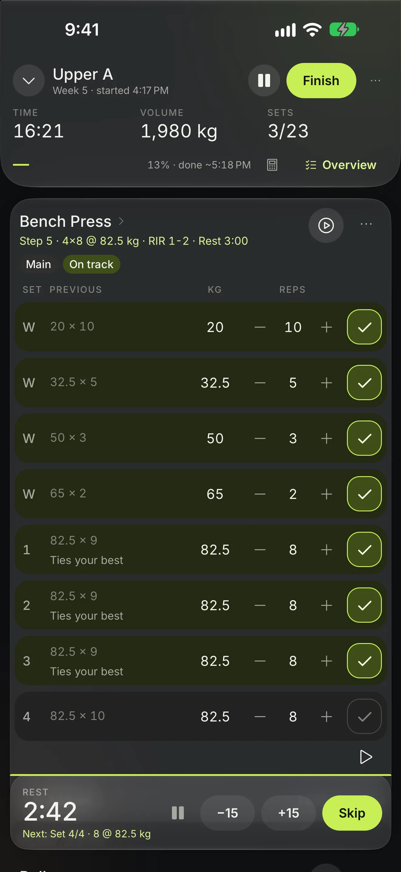 SetForge live workout: Bench Press sets prefilled with weight and reps, ticked sets, and the rest timer counting down.